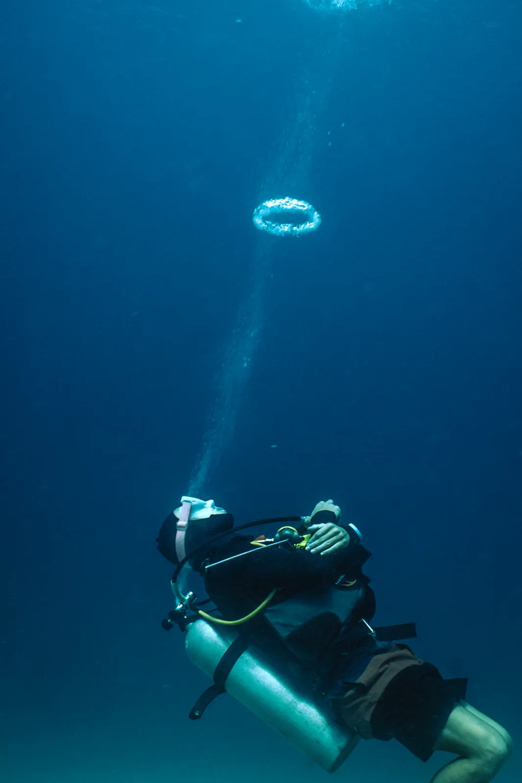 A diver over the coral reef off Gili Air