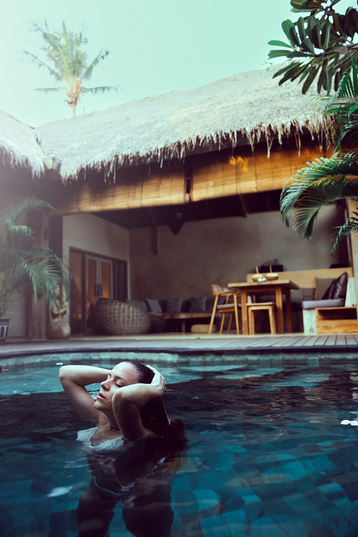 A private pool with sun-loungers beside a two-bedroom family villa at Anahata